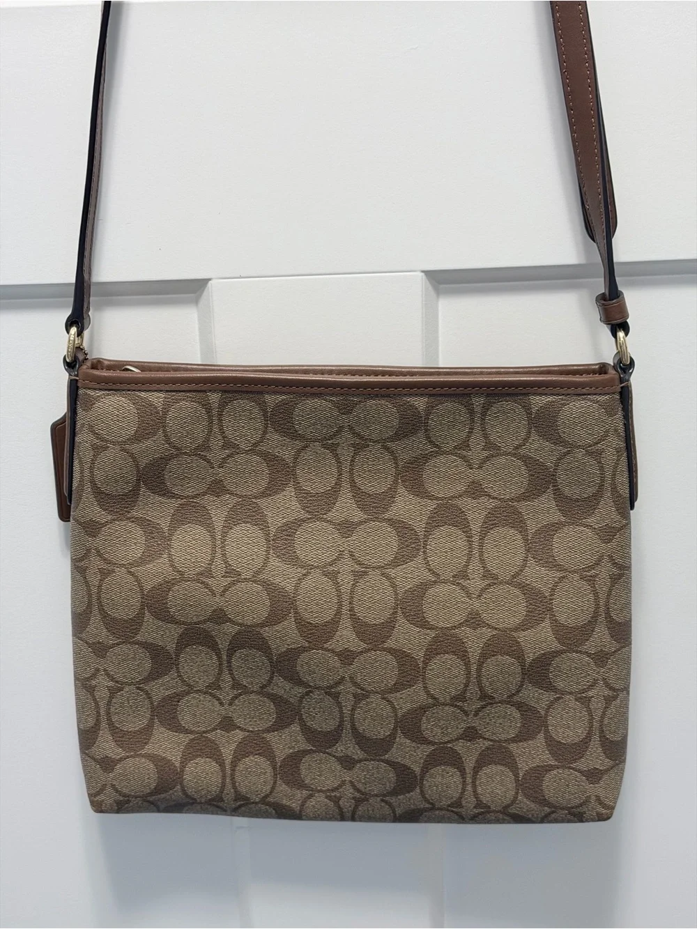 Coach Signature File Crossbody Bag. One of Coach's most popular daily silhouette